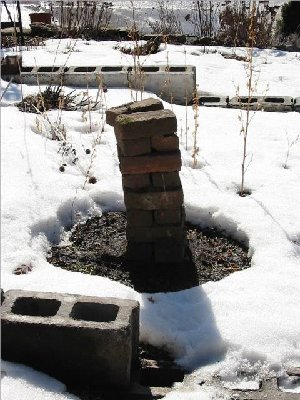 due to the elevation of the yard there is a higher level for the blocks at the east end of the bed - this spring I plan to put a row of blocks across the west end of the upper level creating 2 levels in the bed